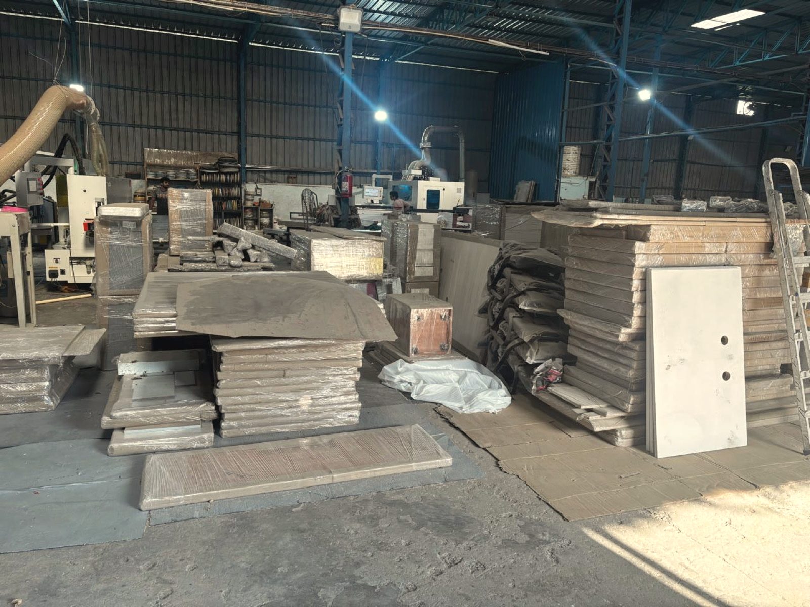 Packed furniture in a project dispatch zone at the OutDo factory