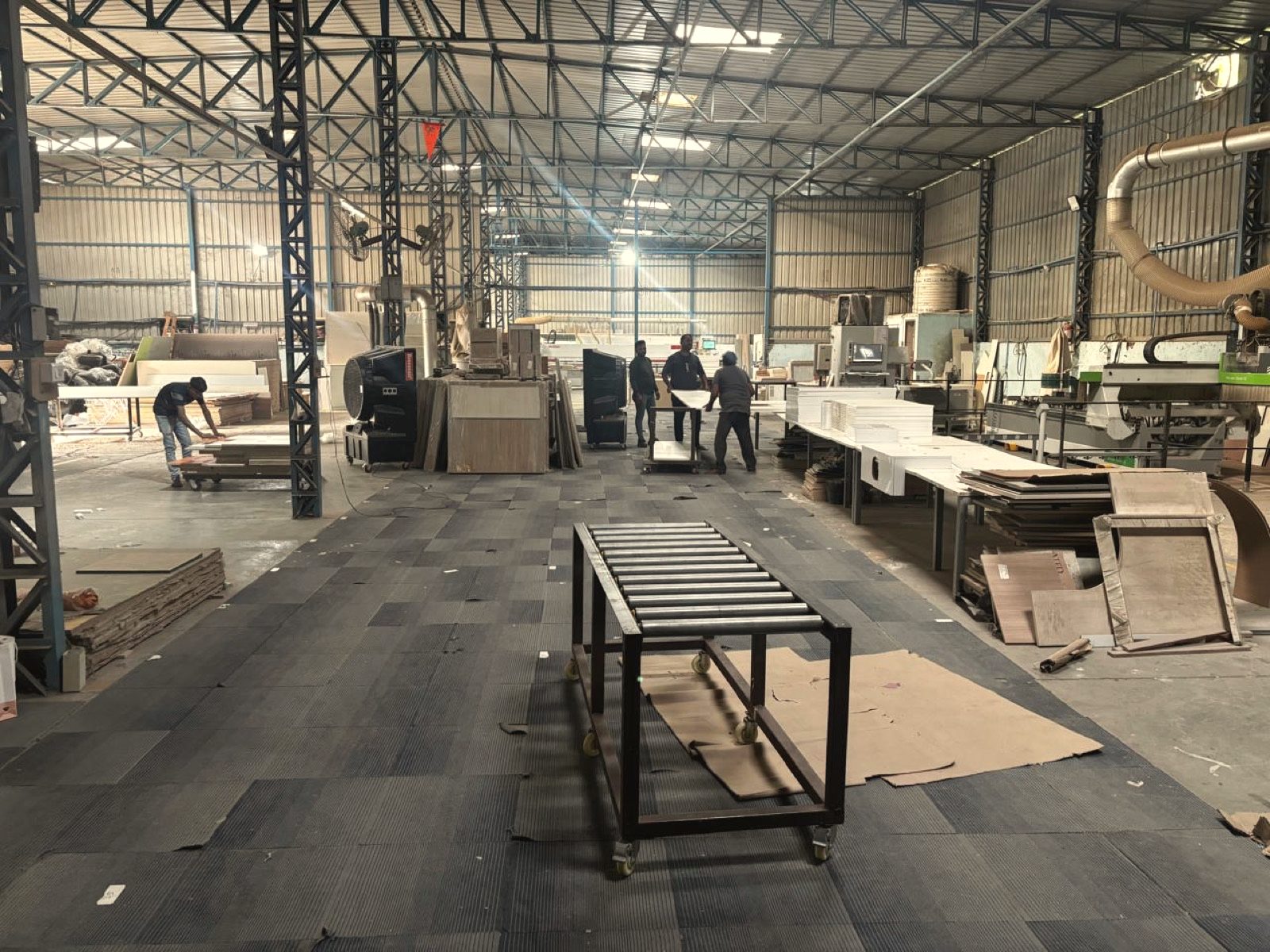 The OutDo production floor near Pune, with panels moving between machines